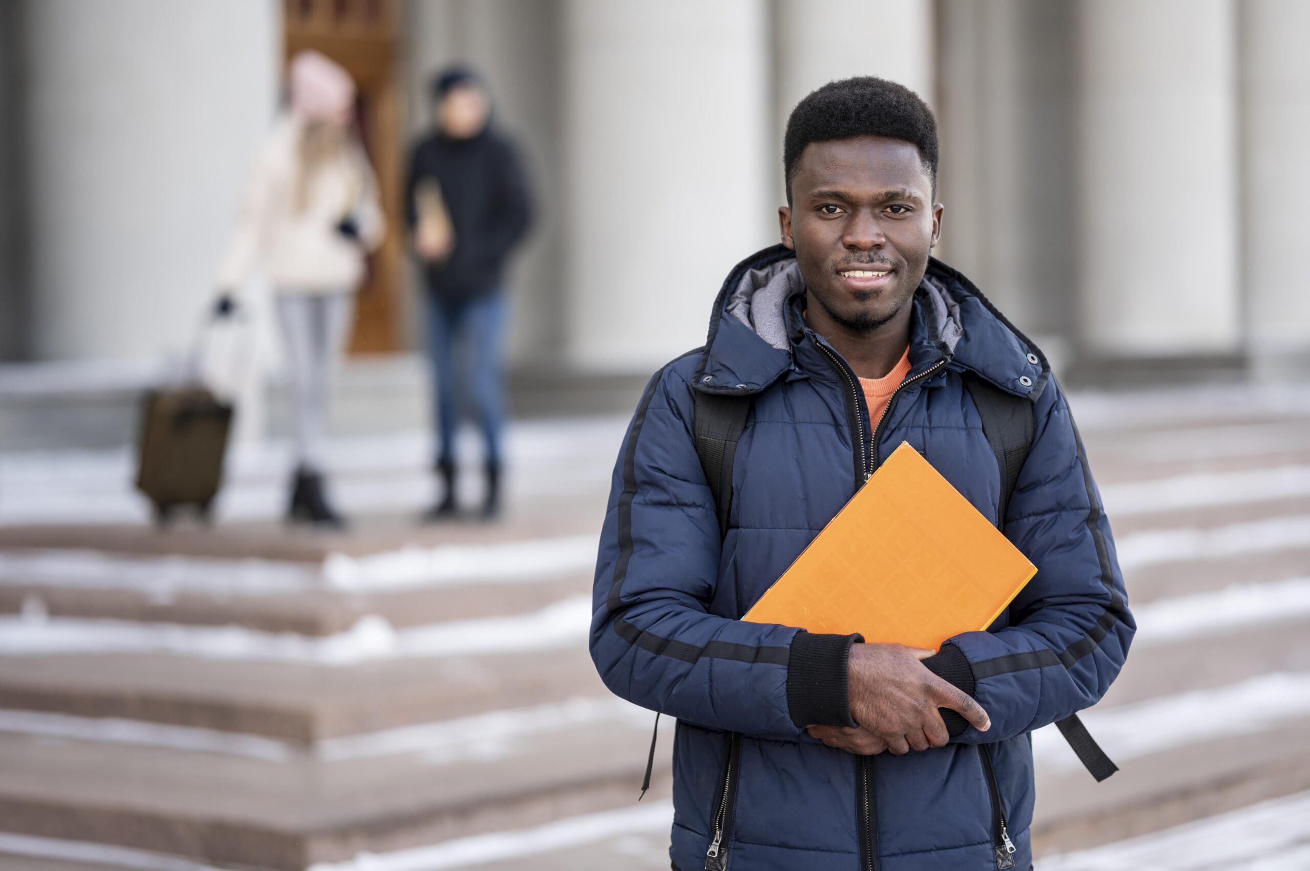 portrait-male-student-with-books